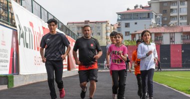 Turkish former Olympics athlete Ersin Tacir (2nd L) trains with his young athletes at the Van Atatürk Stadium, Van, Türkiye, May 23, 2024. (AA Photo)