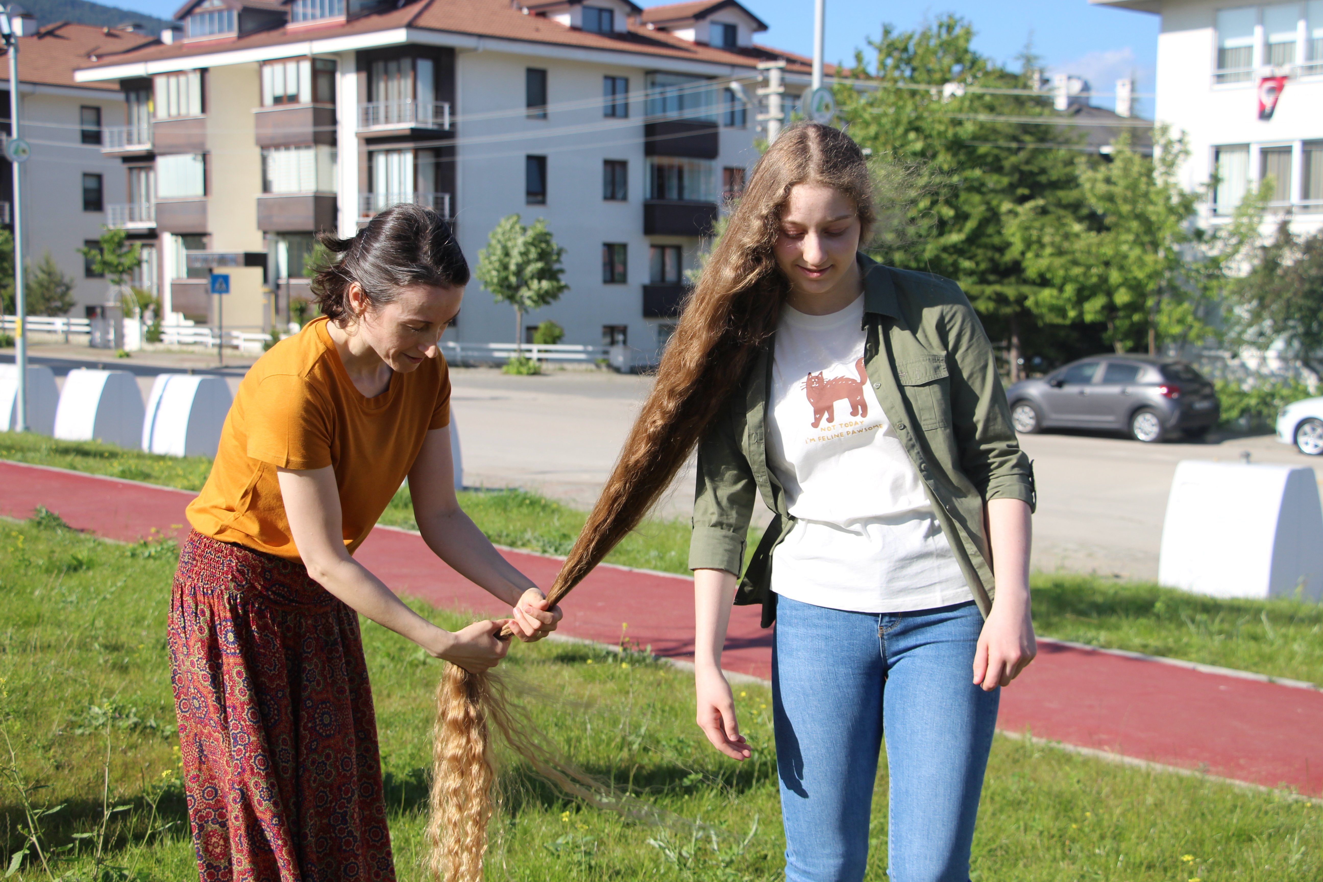 Zeynep Naz Satır boasts hair that has never been cut since birth, now reaching a length equal to her height at 160 centimeters, Bolu, Türkiye, May 23, 2024. (DHA Photo)