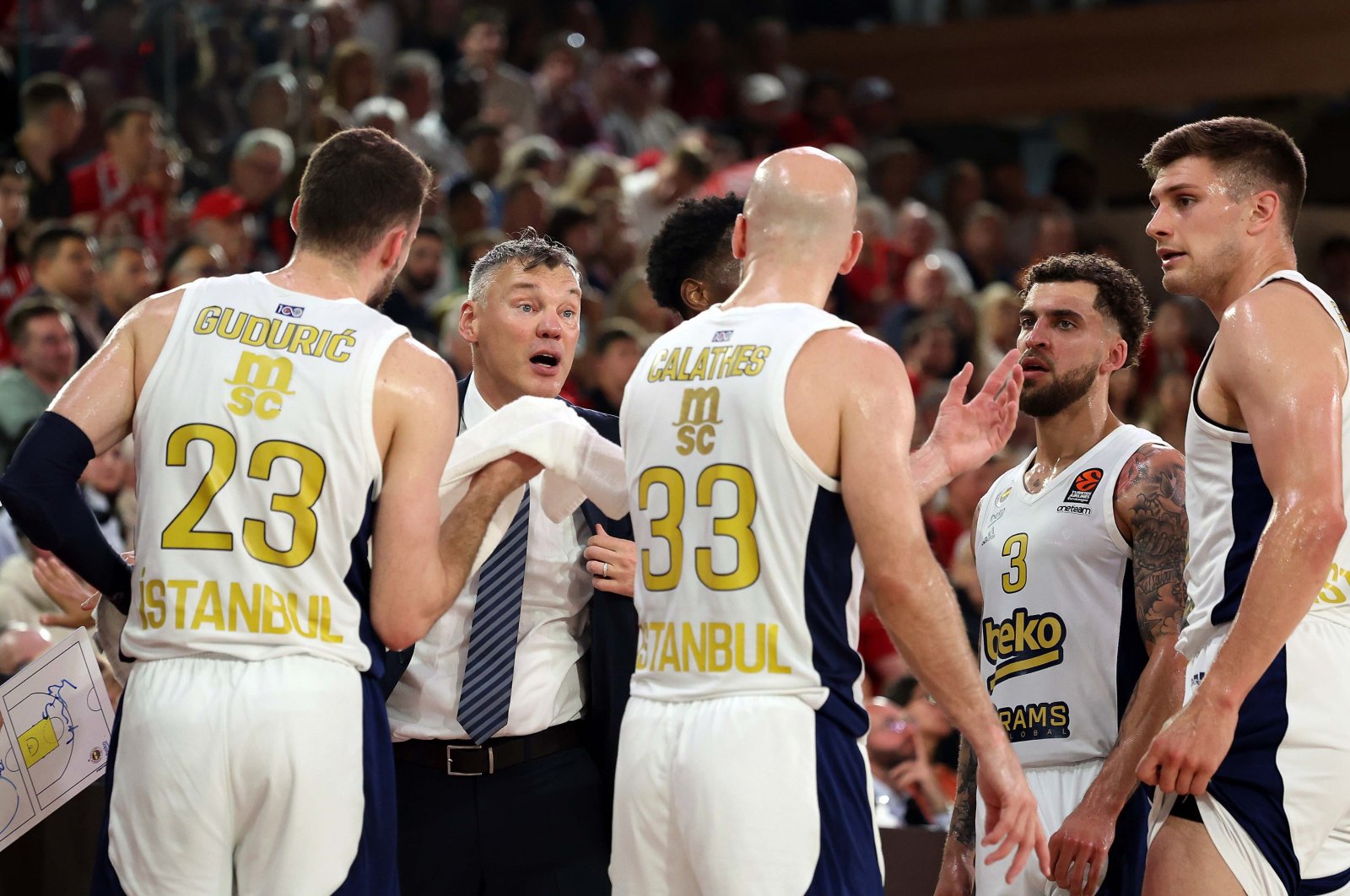 Fenerbahçe head coach Sarunas Jasikevicius (2nd L) gives instructions to his players during the EuroLeague match against Monaco at the Salle Omnisports Gaston, Monaco, Monaco, May 8, 2024. (AA Photo)