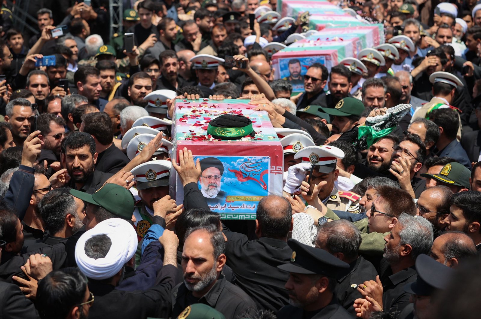 Soldiers carry the coffin of late Iranian president Ebrahim Raisi and others in Birjand, Iran, May 23, 2024. (AFP Photo)