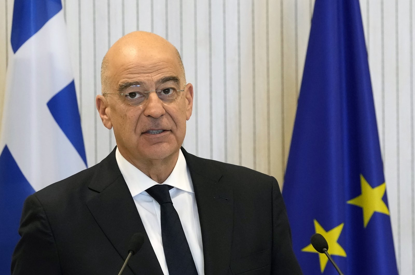 Greek politician Nikos Dendias talks to the media during a news conference in Greek Cyprus, March 31, 2023. (AP File Photo)
