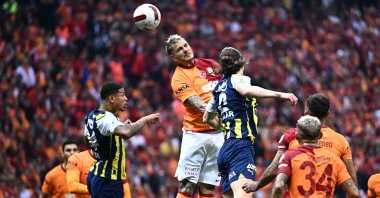 Galatasaray's Mauro Icardi (C) vies for the ball with Fenerbahçe's Çağlar Söyüncü (3rd R) during the Süper Lig match at RAMS Park, Istanbul, Türkiye, May 19, 2024. (AA Photo)