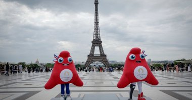 Paris 2024 Olympics (L) and Paralympics mascots "the Phryges" pose during a presentation to the press of the Paris 2024 podium in front of the Eiffel Tower, Paris, France, May 23, 2024. (AFP Photo)