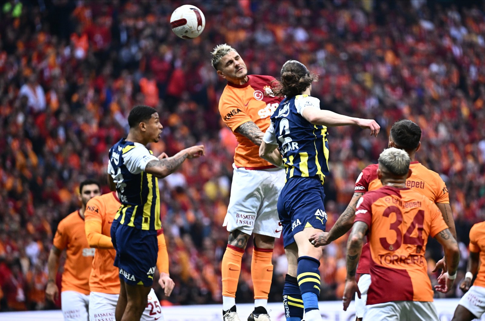 Galatasaray&#039;s Mauro Icardi (C) vies for the ball with Fenerbahçe&#039;s Çağlar Söyüncü (3rd R) during the Süper Lig match at RAMS Park, Istanbul, Türkiye, May 19, 2024. (AA Photo)