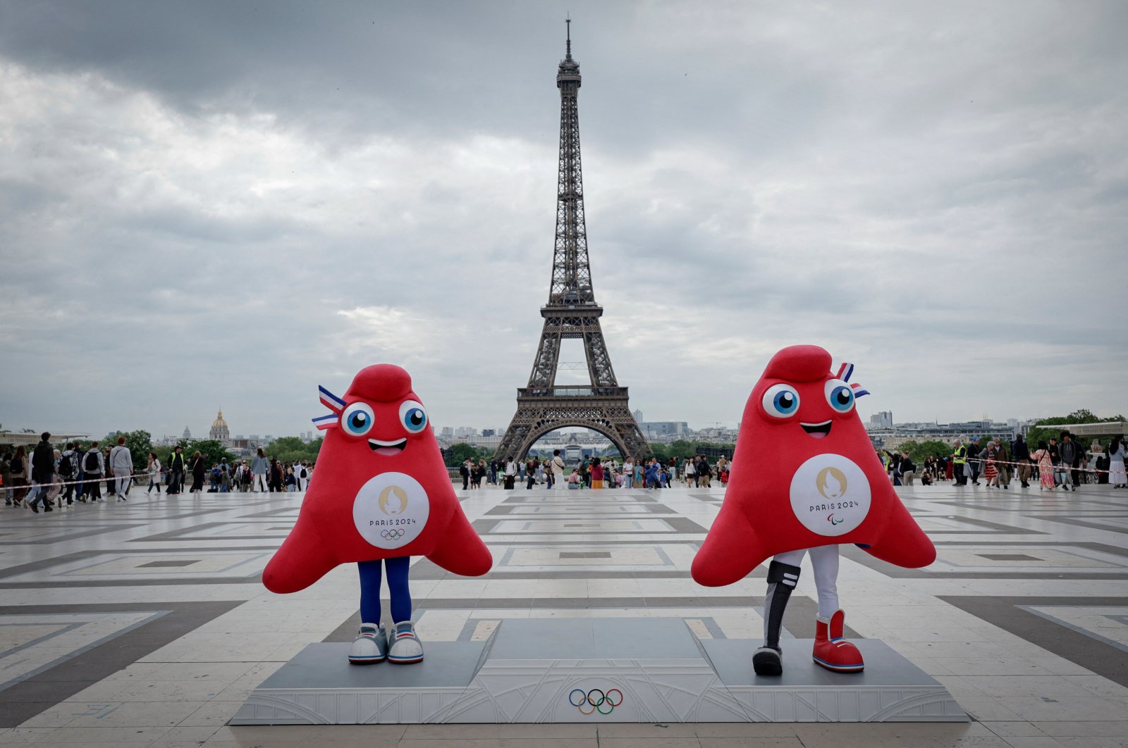 Paris 2024 Olympics (L) and Paralympics mascots "the Phryges" pose during a presentation to the press of the Paris 2024 podium in front of the Eiffel Tower, Paris, France, May 23, 2024. (AFP Photo)