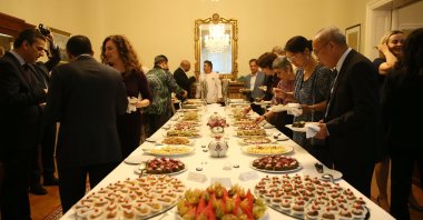 Ambassador Levent Eler (L), Türkiye&#039;s permanent representative to the United Nations office in Vienna, and his wife, Ayten Eler, present tastes from the Aegean region, Vienna, Austria, May 24, 2024. (AA Photo)
