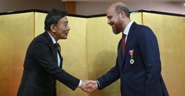 Japanese Ambassador to Ankara Takahiko Katsumata (L) greets Bilal Erdoğan after awarding him the "Order of the Rising Sun, Gold Rays with Rosette," in Ankara, Türkiye, May 25, 2024. (AA Photo)