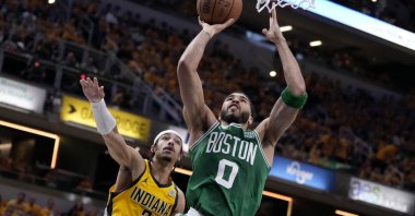 Boston Celtics forward Jayson Tatum (R) drives to the basket past Indiana Pacers guard Andrew Nembhard during an NBA Eastern Conference finals game, Indianapolis, U.S., May 25, 2024. (AP Photo)