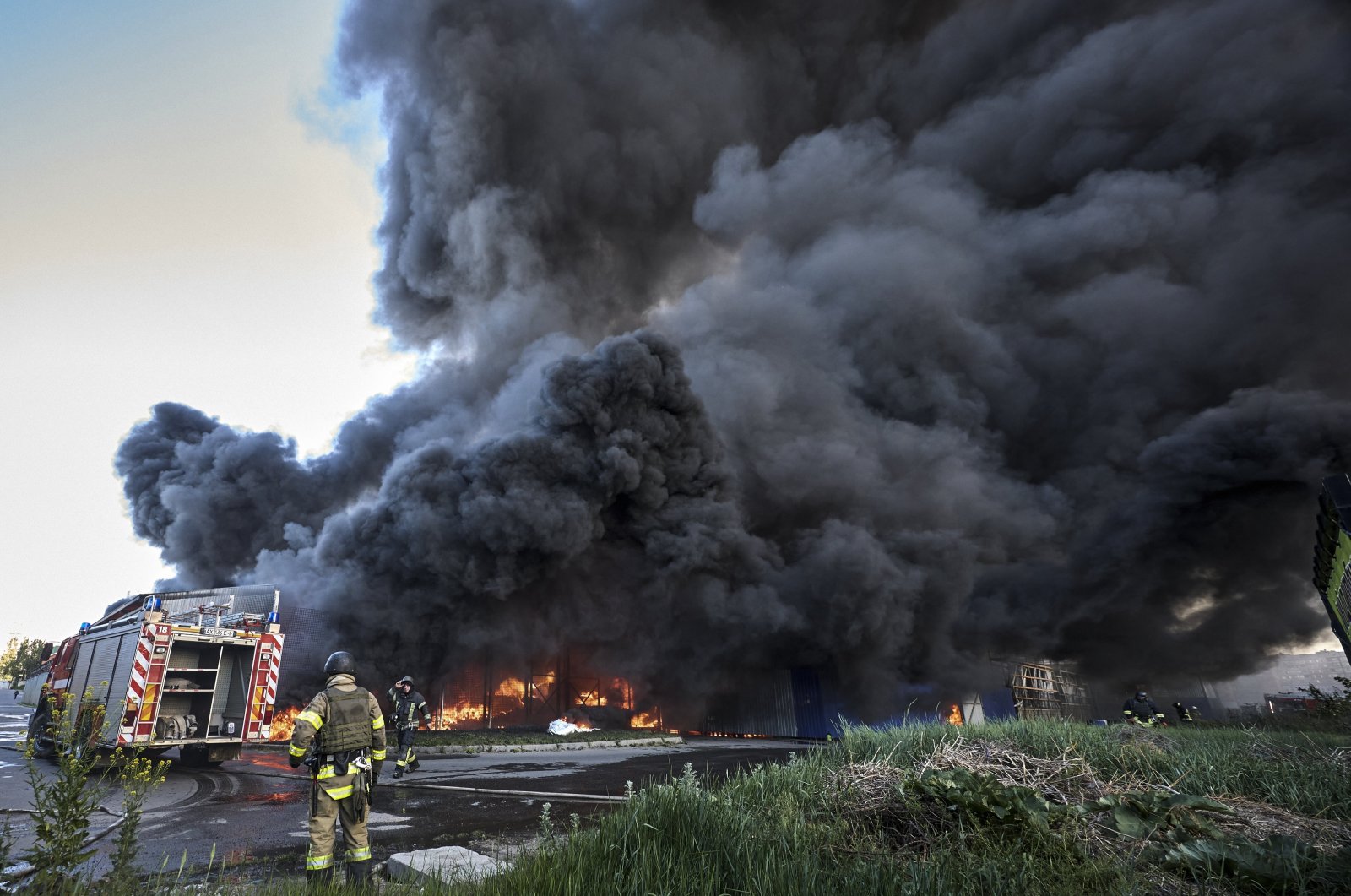 Ukrainian rescuers working at the site of shelling of the hypermarket in Kharkiv, Ukraine, May 25, 2024. (EPA Photo)
