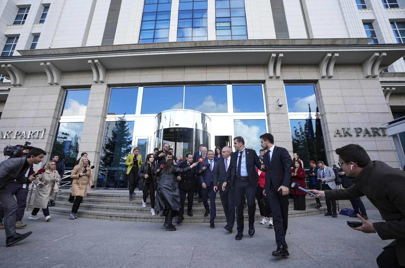 Özgür Özel leaves the Justice and Development Party&#039;s (AK Party) headquarters as reporters rush to ask him questions about meeting with President Recep Tayyip Erdoğan, Ankara, Türkiye, May 2, 2024. (AA Photo)