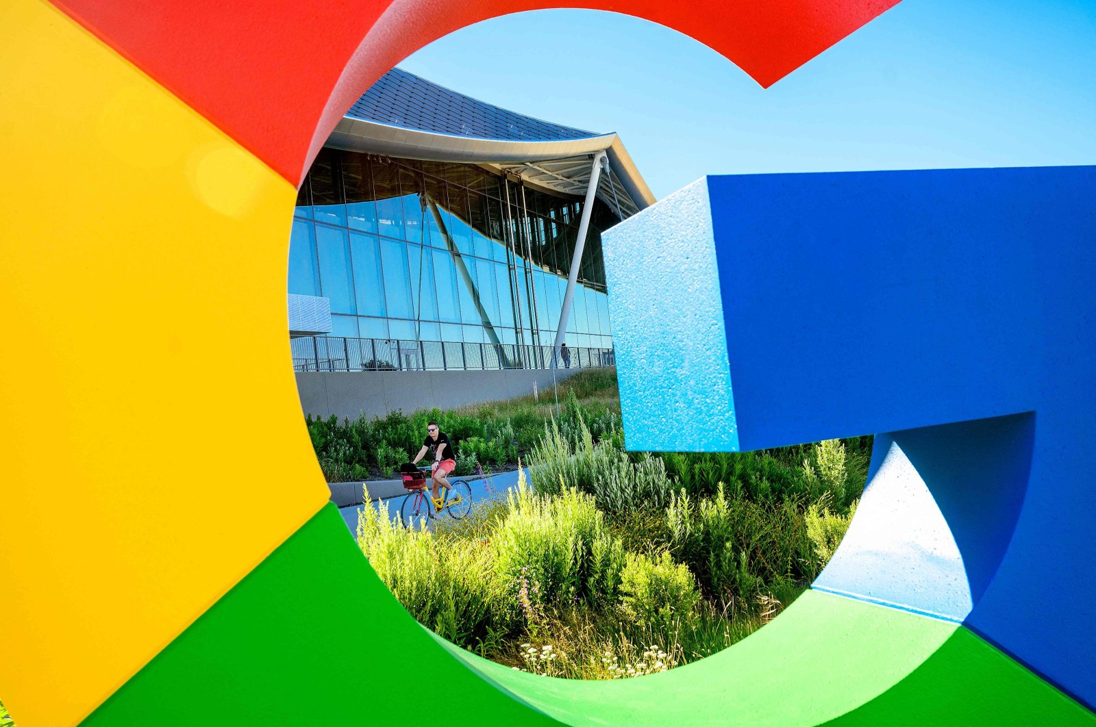 A bicyclist rides along a path at Google’s Bay View campus in Mountain View, California, U.S., June 27, 2022. (AFP Photo)