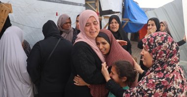 Palestinians mourn by the bodies of relatives killed after an Israeli strike on a camp for internally displaced people in Rafah, Palestine, May 27, 2024. (AFP Photo) 