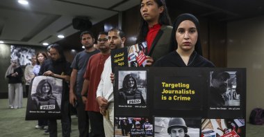 Protesters hold placards reading, "Targeting Journalist is a Crime," in solidarity with Palestinian journalists killed during reporting, in Kuala Lumpur, Malaysia, May 3, 2024. (EPA Photo)