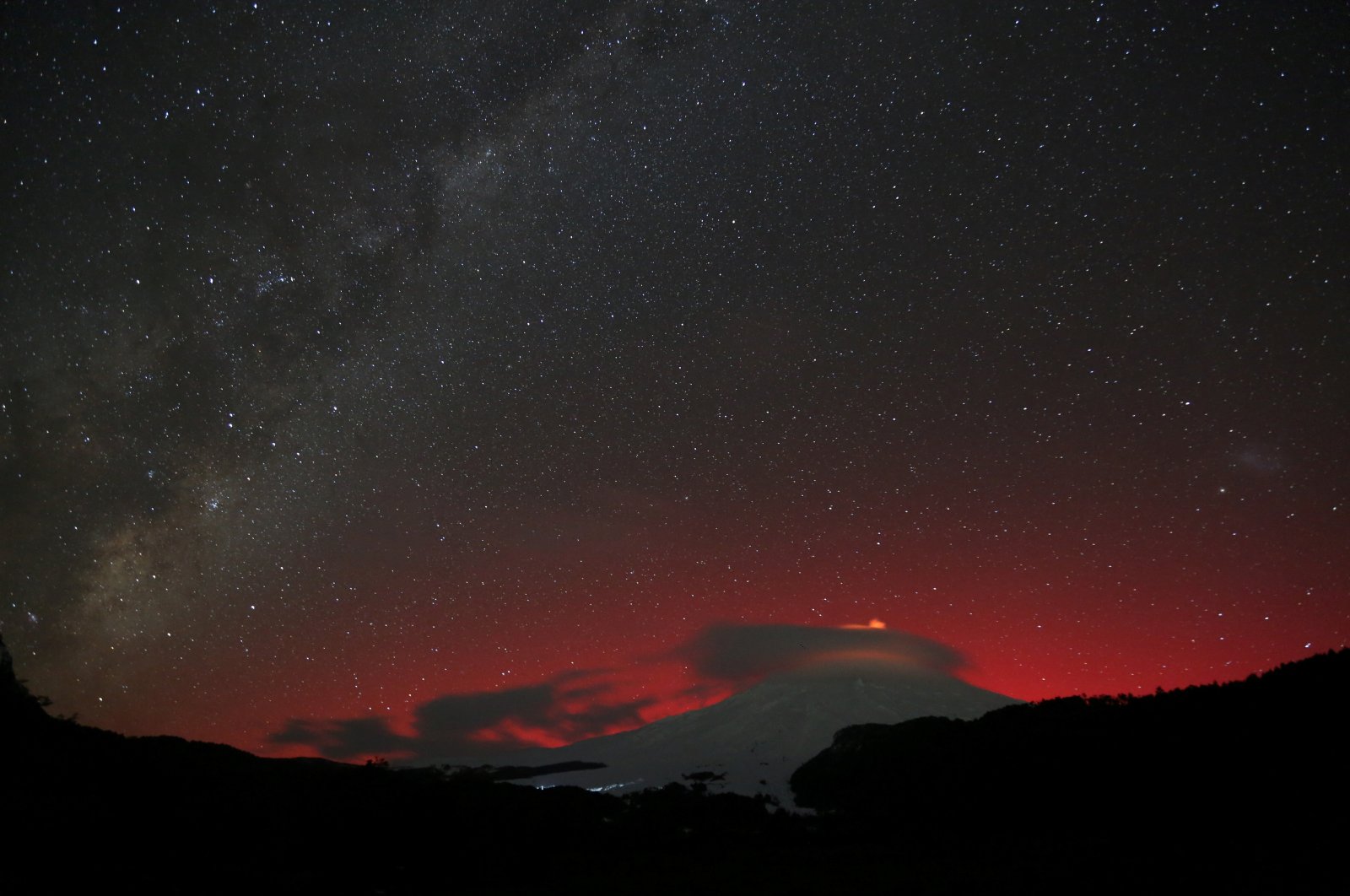 A view shows the lights of an aurora australis caused by a geomagnetic storm over Villarrica volcano, Pucon, Chile, May 10, 2024. (Reuters Photo)