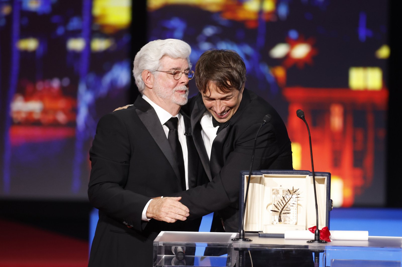 Sean Baker (R) receives the Palme D&#039;Or Award for &quot;Anora&quot; from George Lucas (L) during the closing and awards ceremony of the 77th annual Cannes Film Festival, Cannes, France, May 25, 2024. (EPA Photo)