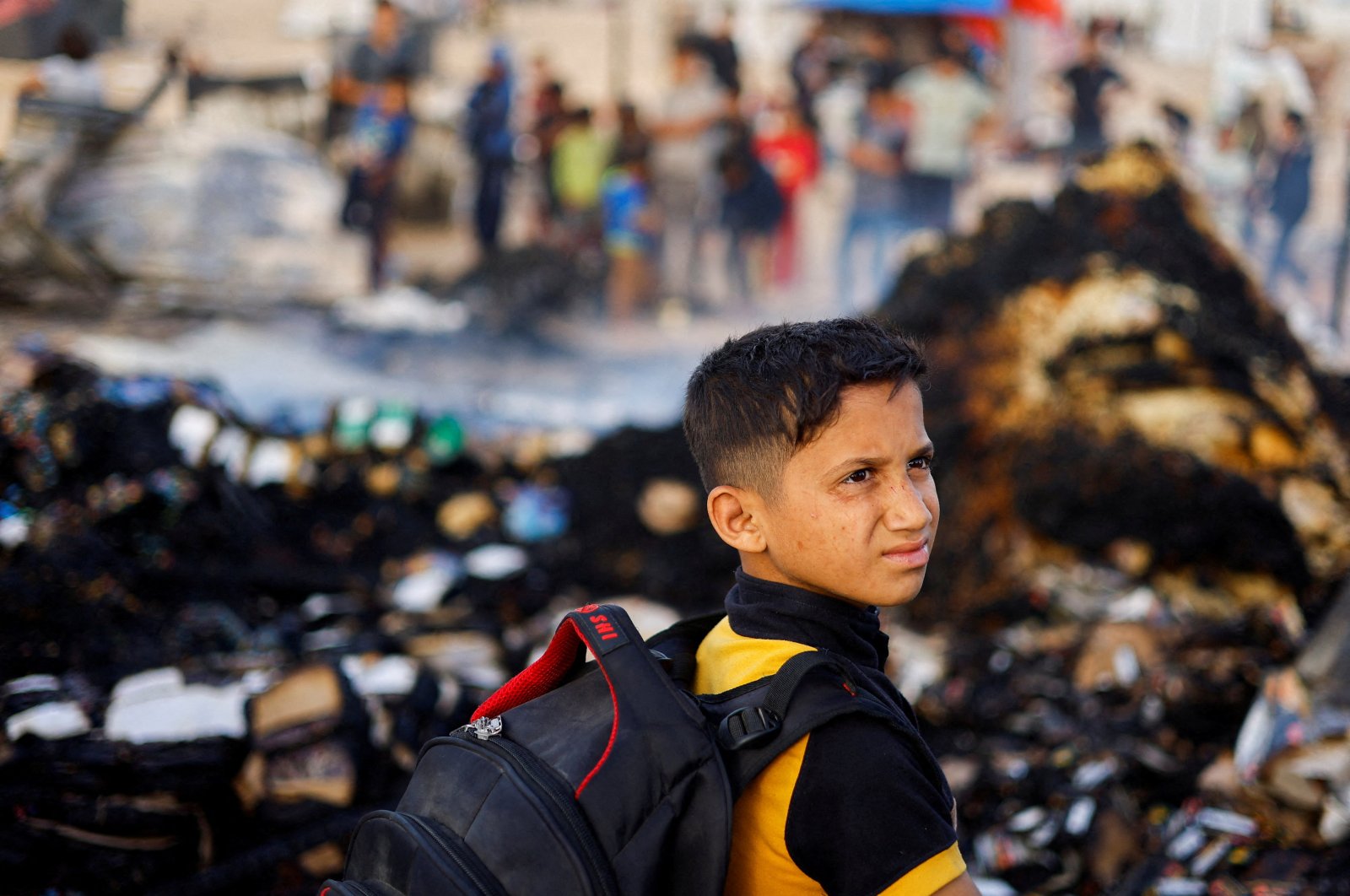 A Palestinian boy looks on at the site of an Israeli strike on an area designated for displaced people, in Rafah in the southern Gaza Strip, May 27, 2024. (Reuters Photo)