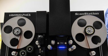 A film specialist digitizes film at Pro-Tek Vaults in Burbank, California, May 7, 2024. (AFP Photo)