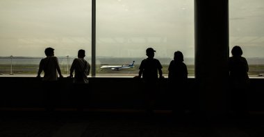 People gather at the observation area of the departures hall at Haneda airport, Tokyo, Japan, April 29, 2024. (AFP Photo)