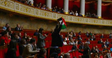 French leftist La France Insoumise (LFI) party member of parliament Sebastien Delogu waves a Palestinian national flag during a session of questions to the government at the National Assembly in Paris, May 28, 2024. (AFP Photo)