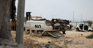 A view shows a damaged U.N. vehicle as Palestinians inspect a tent camp damaged in an Israeli strike, in Rafah, in the southern Gaza Strip, May 28, 2024. (Reuters Photo)