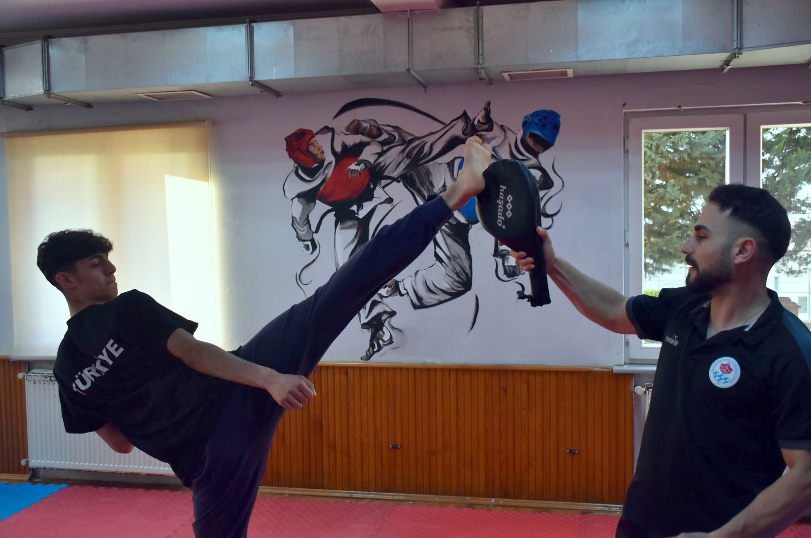 Turkish taekwondo athlete Furkan Ubeyde Çamoğlu (L) trains at the Trabzon Metropolitan Municipality Sports Club, Trabzon, Türkiye, May 21, 2024. (AA Photo)