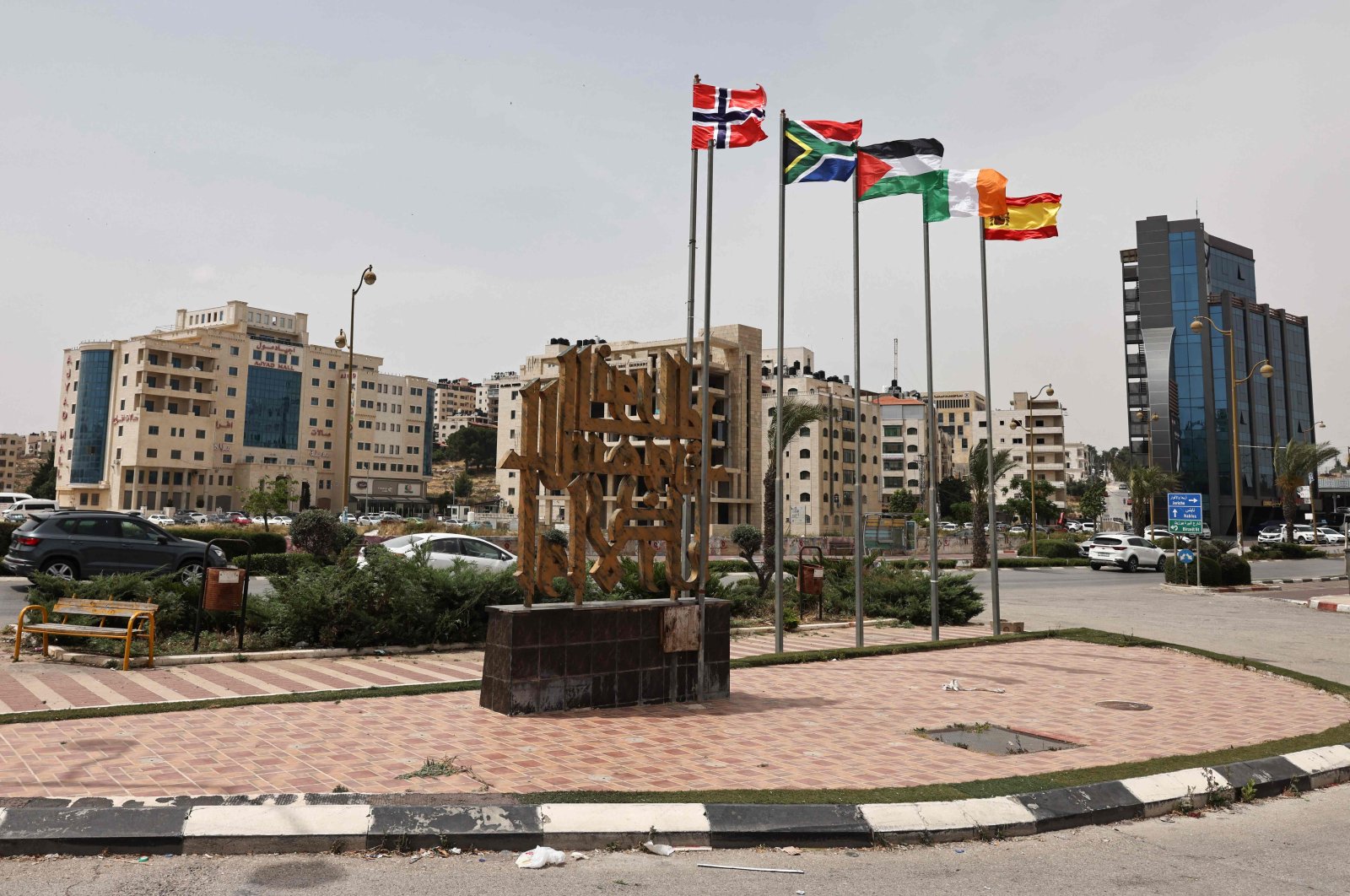 (L-R) The flags of Norway, South Africa, Palestine, Ireland, and Spain, are raised at an entrance of Ramallah city in the occupied West Bank, Palestine, May 28, 2024. (AFP Photo)