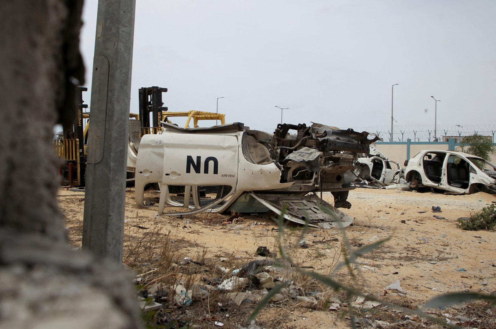 A view shows a damaged U.N. vehicle as Palestinians inspect a tent camp damaged in an Israeli strike, in Rafah, in the southern Gaza Strip, May 28, 2024. (Reuters Photo)