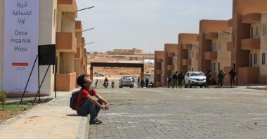 A child looks on at a block of newly constructed homes for displaced people near the town of Qabasin, northeast of al-Bab, some 30 kilometers from Aleppo, Syria, May 28, 2024. (AFP Photo)