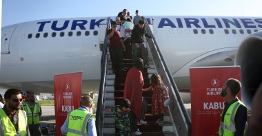 Passengers disembark from a plane after Turkish Airlines resumes operations in Kabul, Afghanistan, May 21, 2024. (EPA Photo)