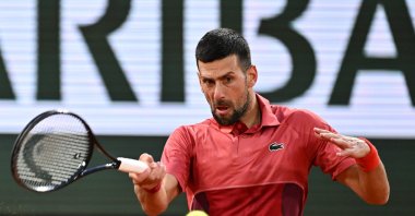 Serbia's Novak Djokovic plays a backhand return to France's Pierre-Hugues Herbert during their French Open men's singles match on Court Philippe-Chatrier at the Roland Garros Complex, Paris, France, May 28, 2024. (AA Photo)