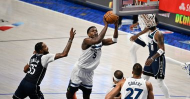 Minnesota Timberwolves guard Anthony Edwards (2nd L) shoots against the Dallas Mavericks during the fourth quarter of game four of the western conference finals for the 2024 NBA playoffs at American Airlines Center, Dallas, Texas, U.S., May 28, 2024. (Reuters Photo)