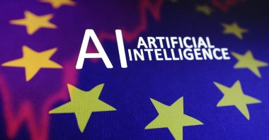The EU flag, a stock graph and the words &quot;AI Artificial Intelligence&quot; are seen in this illustration taken May 21, 2024. (Reuters Photo)
