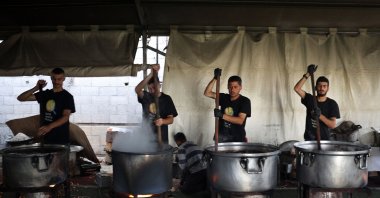 Local volunteers of the World Central Kitchen cook meals to be distributed to needy Palestinians in Rafah, southern Gaza Strip, Palestine, May 3, 2024. (AFP Photo)