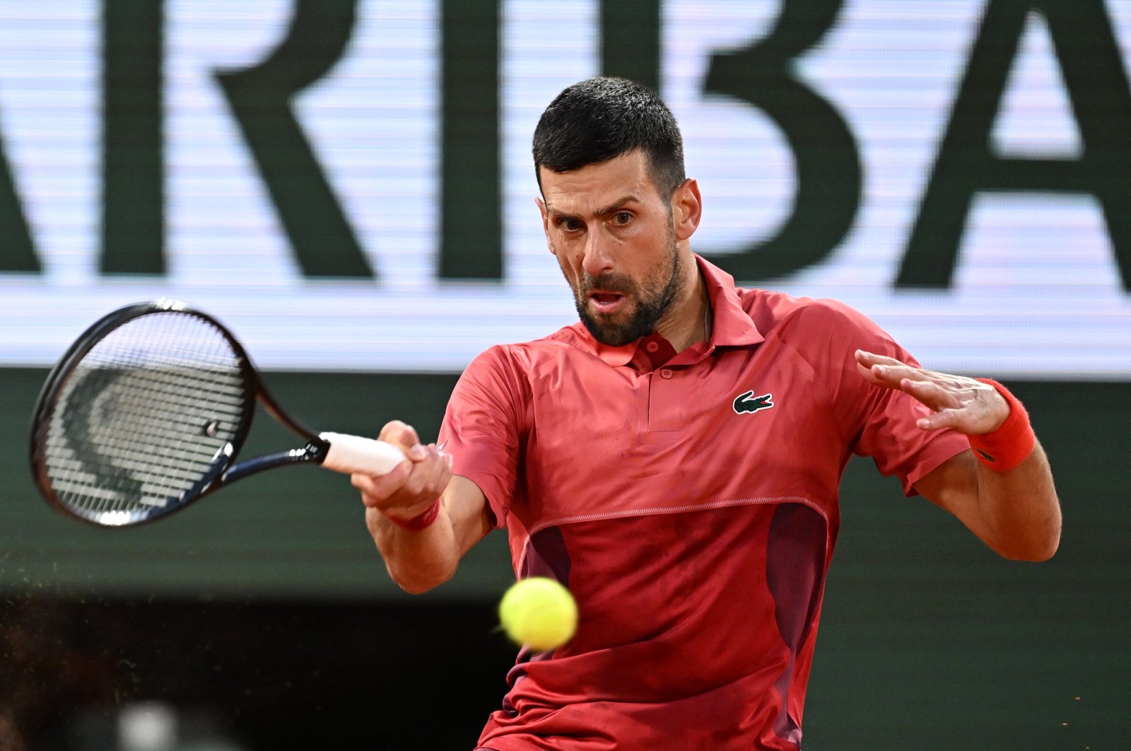 Serbia&#039;s Novak Djokovic plays a backhand return to France&#039;s Pierre-Hugues Herbert during their French Open men&#039;s singles match on Court Philippe-Chatrier at the Roland Garros Complex, Paris, France, May 28, 2024. (AA Photo)