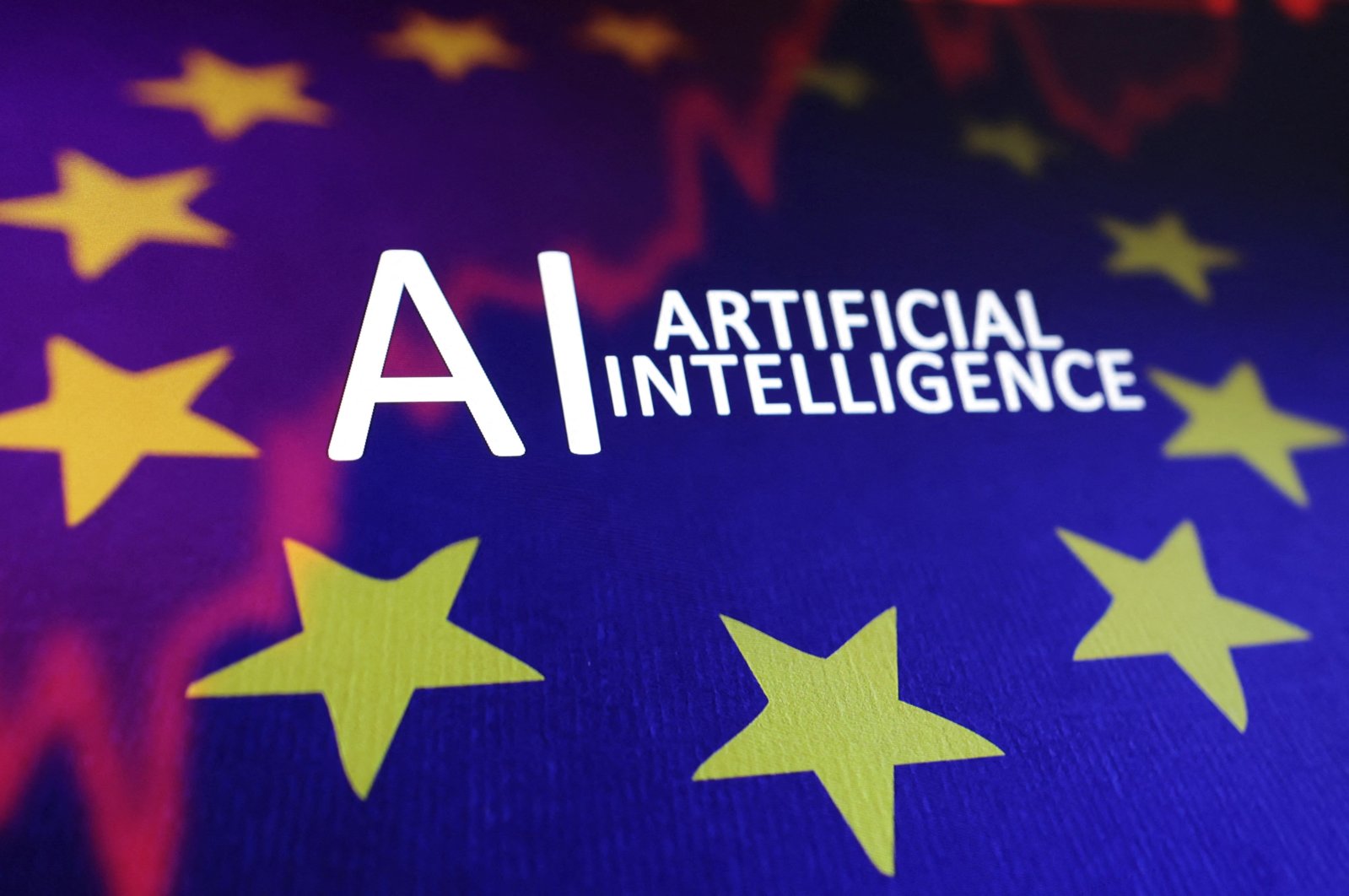 The EU flag, a stock graph and the words &quot;AI Artificial Intelligence&quot; are seen in this illustration taken May 21, 2024. (Reuters Photo)