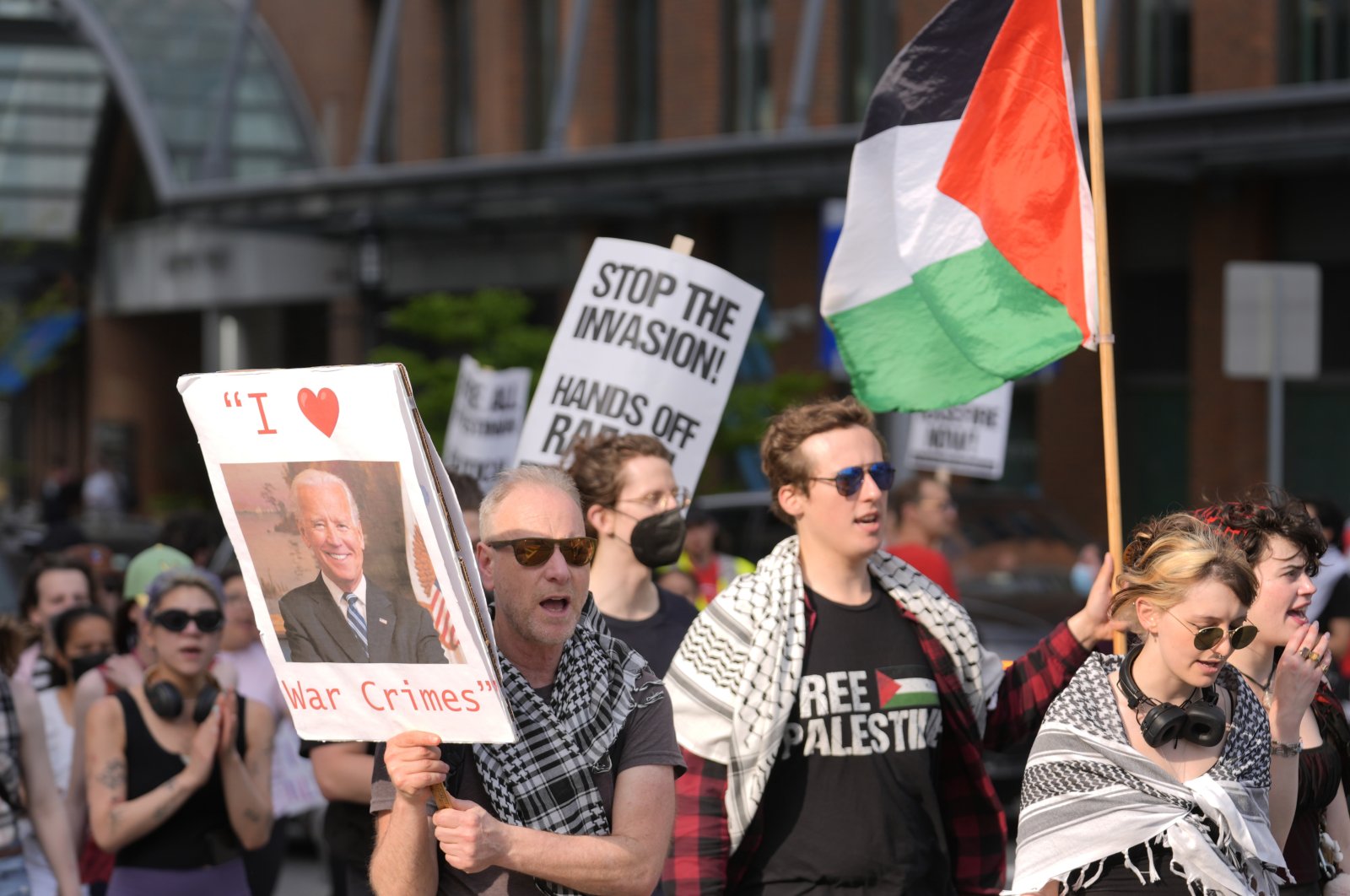 Demonstrators display placards and chant slogans while marching, in Boston, U.S., May 21, 2024. (AP Photo/Steven Senne)