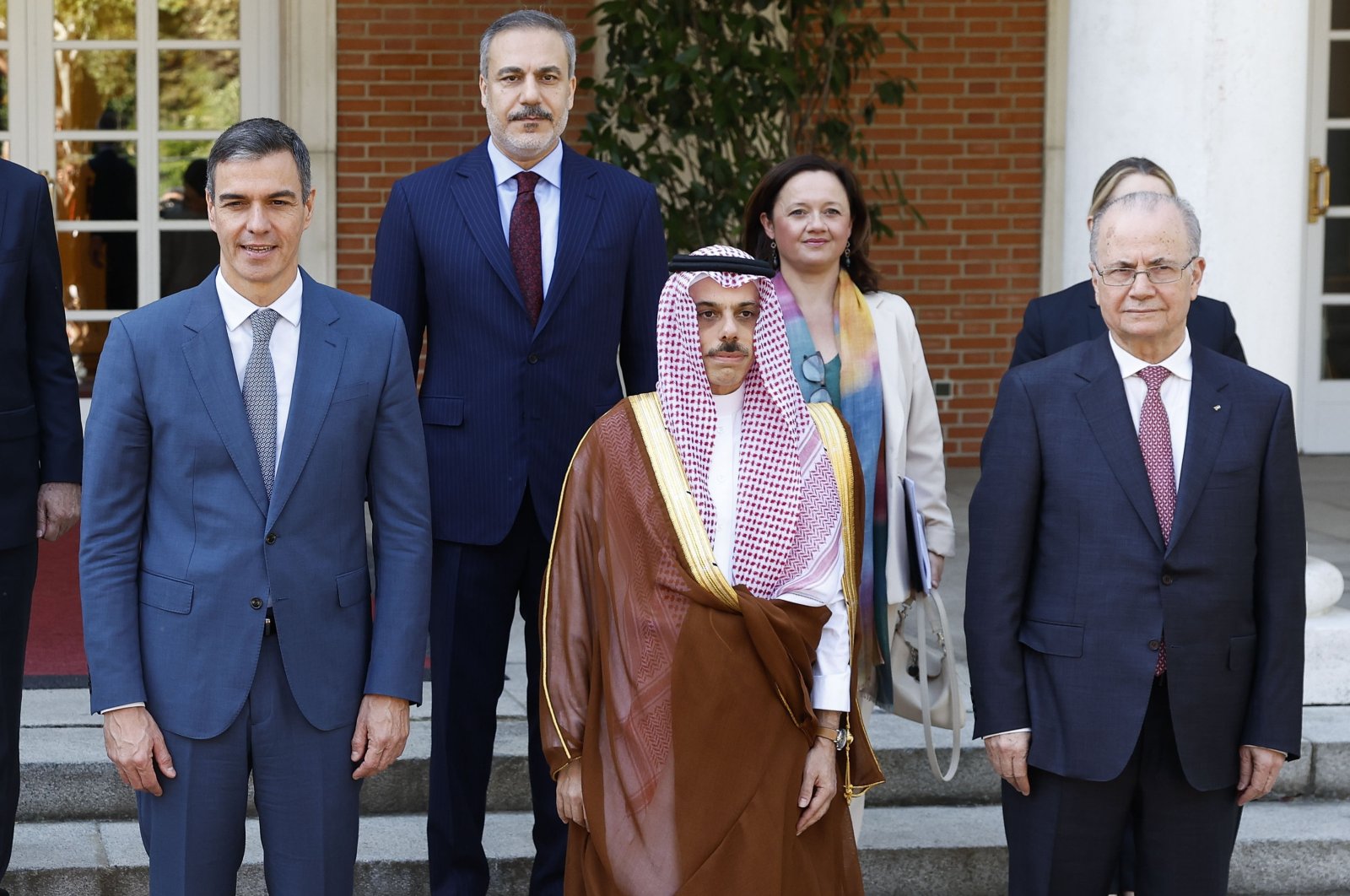 Spanish PM Pedro Sanchez (L) poses for a family photo with Saudi FM Faisal bin Farhan Al Saud (C), Palestinian PM Mohammad Mustafa (R), Turkish FM Hakan Fidan (back C-L), Spanish General Secretary for Foreign Affairs Emma Aparici (back 2nd R) and others, Madrid, Spain, May 28, 2024. (EPA Photo)