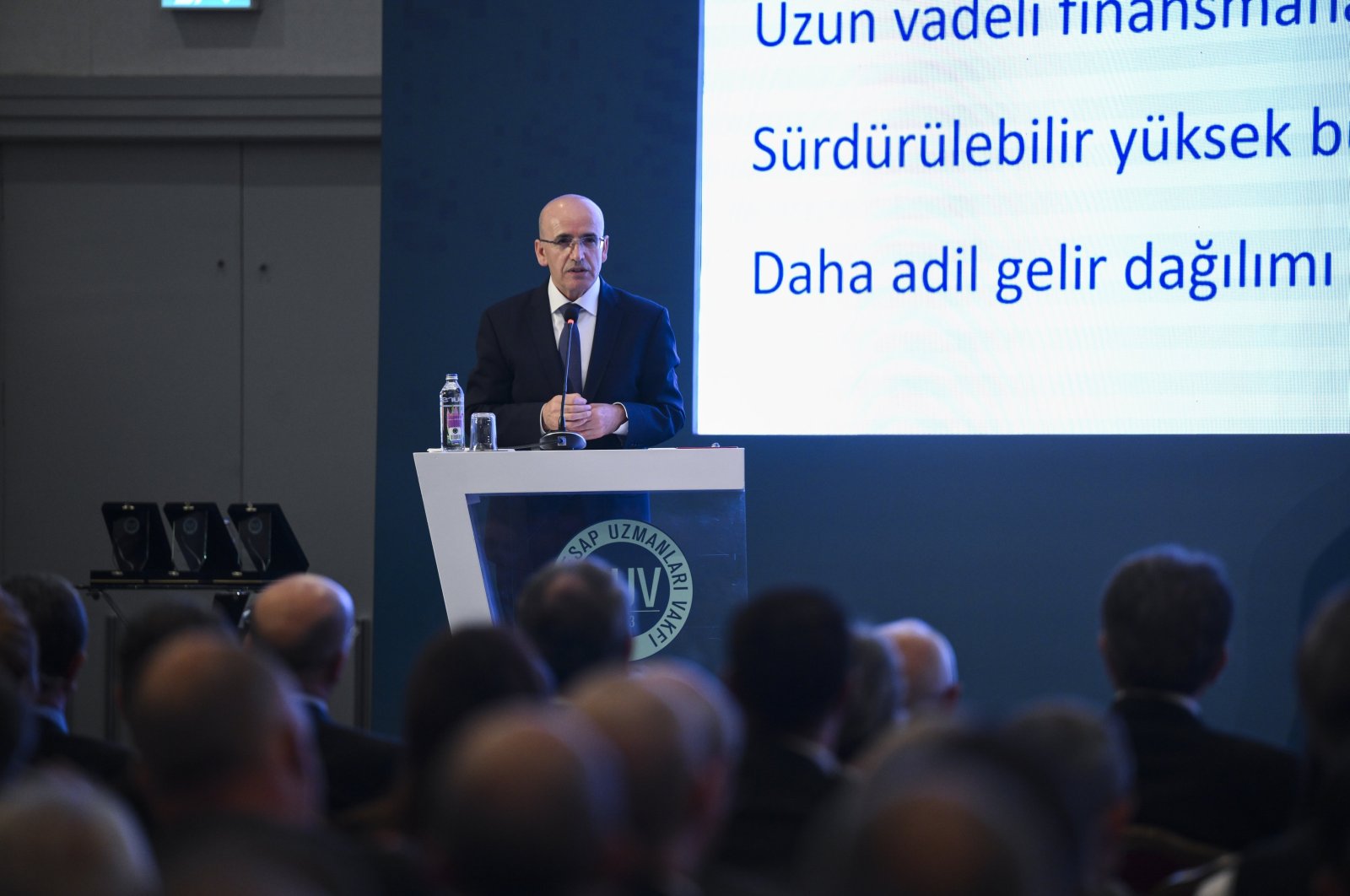 Treasury and Finance Minister Mehmet Şimşek delivers a speech during an event in Istanbul, Türkiye, May 29, 2024. (AA Photo)