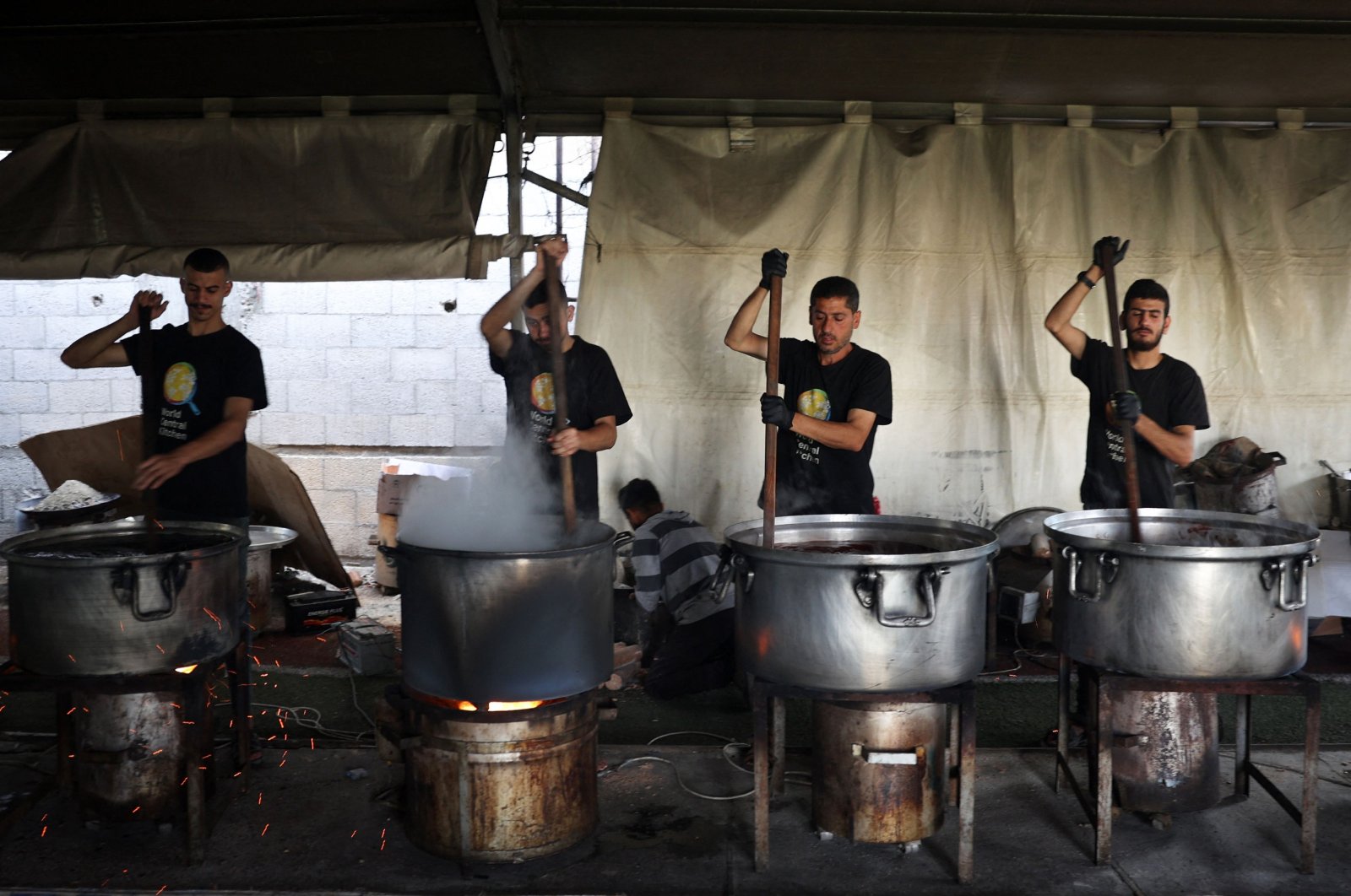 Local volunteers of the World Central Kitchen cook meals to be distributed to needy Palestinians in Rafah, southern Gaza Strip, Palestine, May 3, 2024. (AFP Photo)