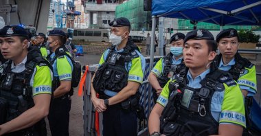 Police officers stand guard outside the West Kowloon Magistrates' Courts during a verdict for 47 pro-democracy activists in Hong Kong, China, May 30, 2024. (EPA Photo)