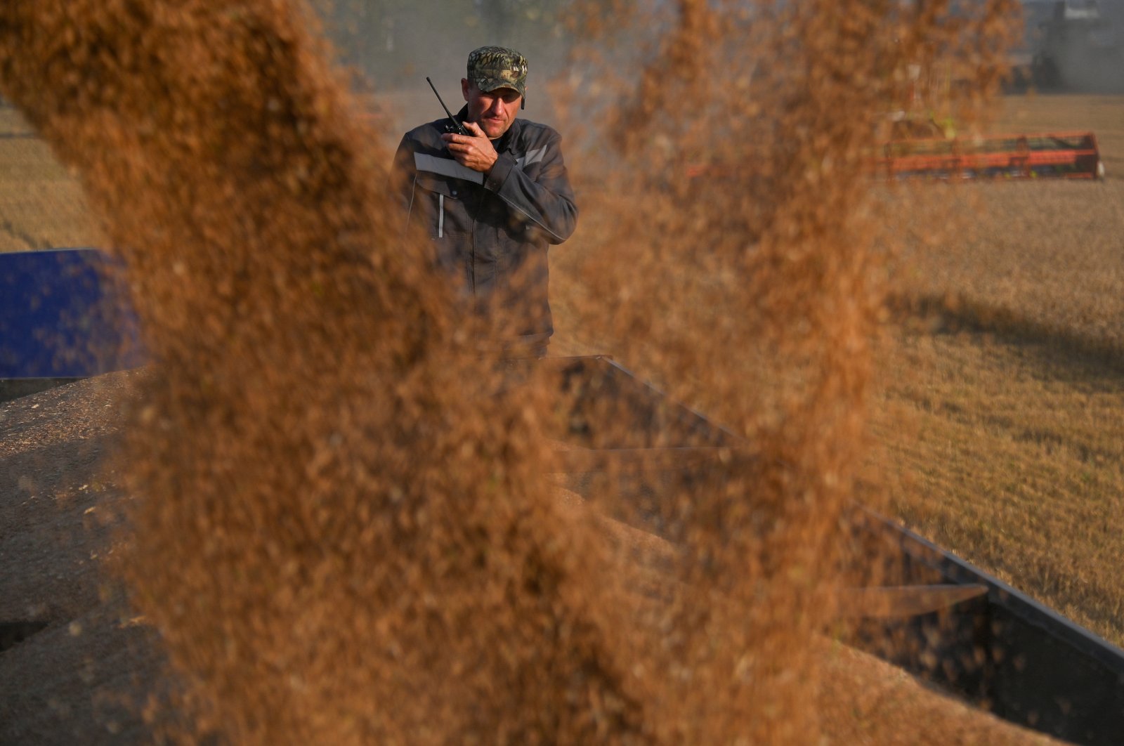 An employee controls the loading of wheat into a truck during harvest in a field of a local agricultural enterprise in the Cherlaksky district of the Omsk region, Russia, Sept. 8, 2023. (Reuters Photo)