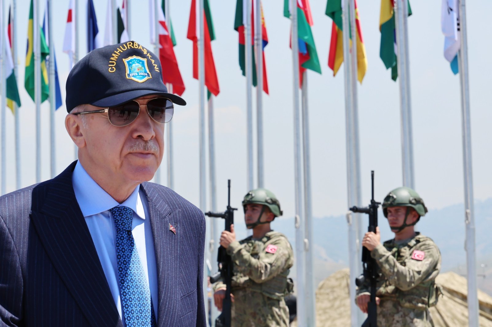 President Recep Tayyip Erdoğan walks past troops attending a military exercise in Izmir, western Türkiye, May 30, 2024. (AA Photo)