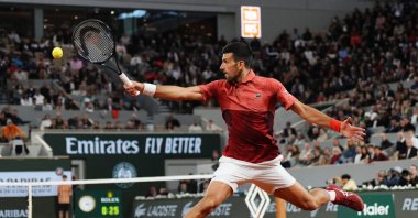 Serbia&#039;s Novak Djokovic plays a backhand return to Spain&#039;s Roberto Carballes Baena during their singles match on Day 5 of the French Open at Roland Garros, Paris, France, May 30, 2024. (AFP Photo)
