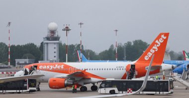 An easyJet airplane is towed at Linate Airport, Milan, Italy, May 2, 2024. (Reuters Photo)