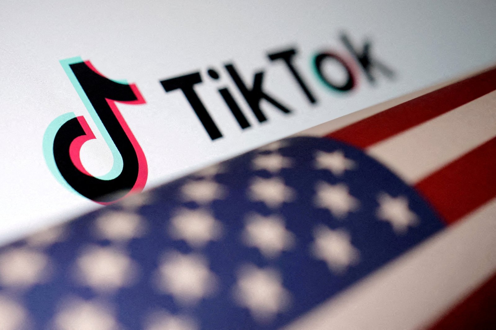 The U.S. flag is placed on a TikTok logo in this illustration taken March 20, 2024. (Reuters Photo)