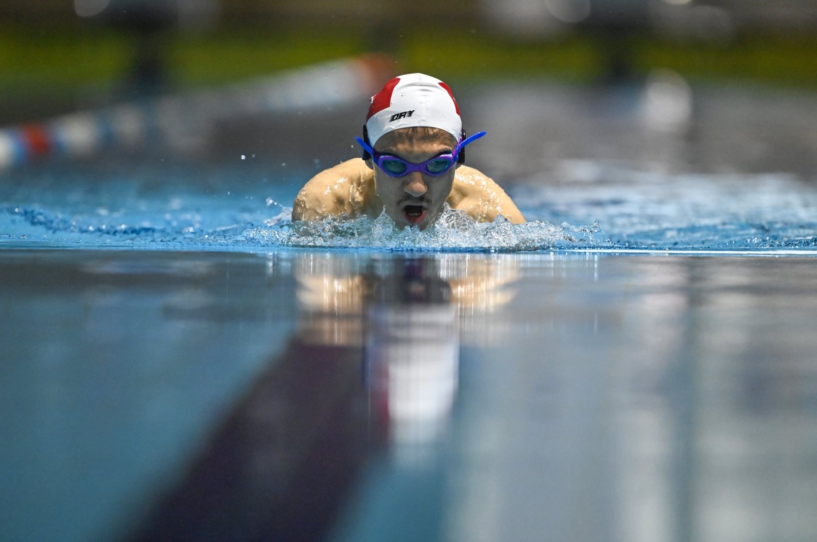 Paralympic swimmer Umut Ünlü trains for the 17th Paralympic Summer Games, Van, Türkiye, May 21, 2024. (AA Photo)