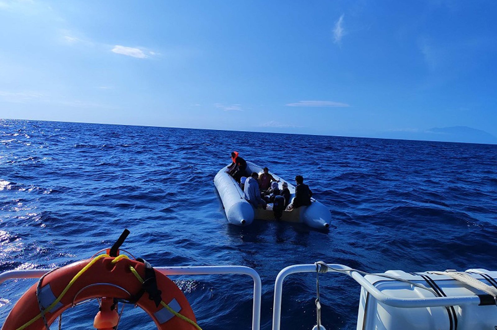 Irregular migrants are seen on a dinghy off the coast of Izmir in this photo released on May 31, 2024. (DHA Photo)