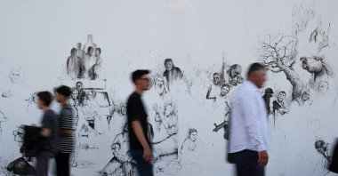 The 27-year-old painter Kasım Tan depicts the suffering to raise awareness in the face of the attacks carried out by Israel in Gaza, Istanbul, Türkiye, May 30, 2024. (AA Photo)