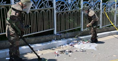 South Korean soldiers examine various objects from a balloon believed to have been sent by North Korea, in Incheon, South Korea, June 2, 2024. )