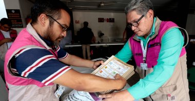Officials from the National Electoral Institute (INE) prepare a package with electoral material in Guadalajara, Jalisco state, Mexico, on May 31, 2024. (AFP Photo)